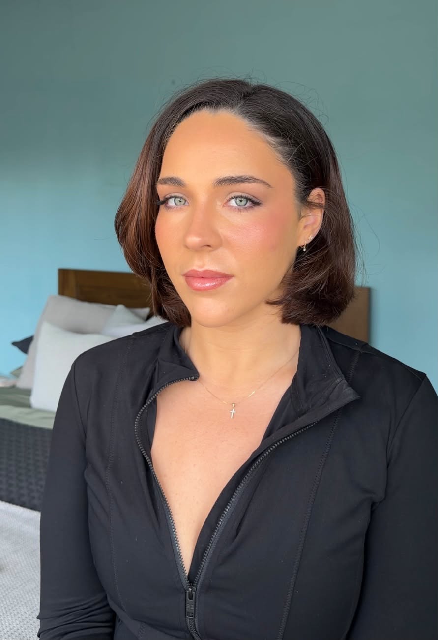 Soft glam: fluttery lashes framing green eyes, flushed cheeks and a pink gloss lip